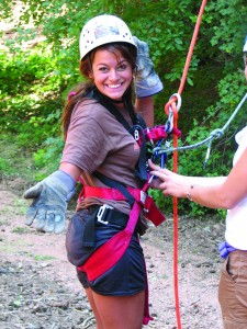 Camper prepping for ropes course